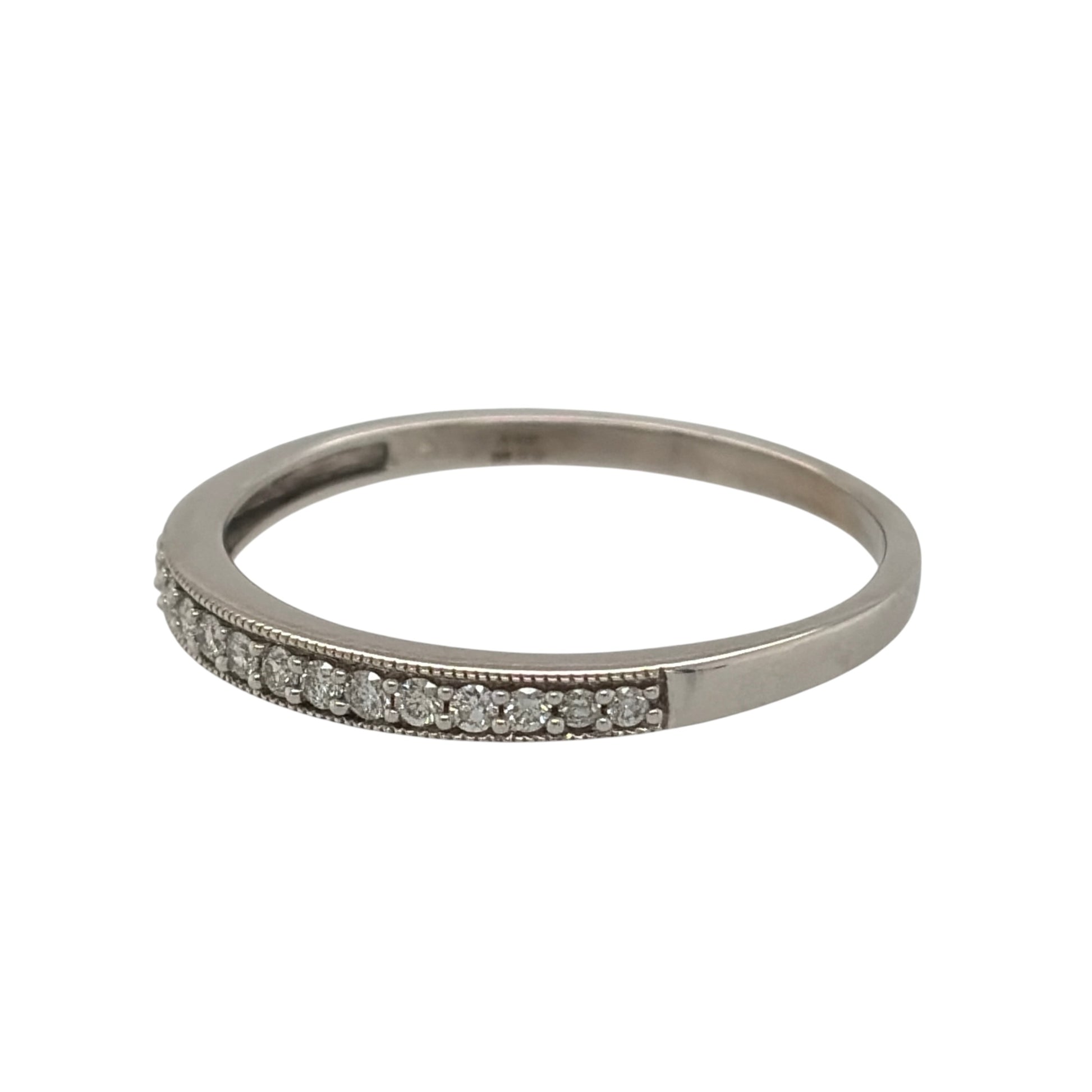 This pre-owned 9ct white gold diamond band ring is a classic design, featuring diamond detailing set across the front of the band.

Design: Featuring a simple band design with diamonds set across the front, this ring has a clean and timeless finish in 9ct white gold.
Material: Made from 9-carat white gold.
Gemstone Detail: Set with approximately 0.20ct of diamond content in total.
Ring Detail: The front of the band measures approximately 2.5mm wide.
Size & Weight: Ring size Z. Total weight 2.30 grams.
