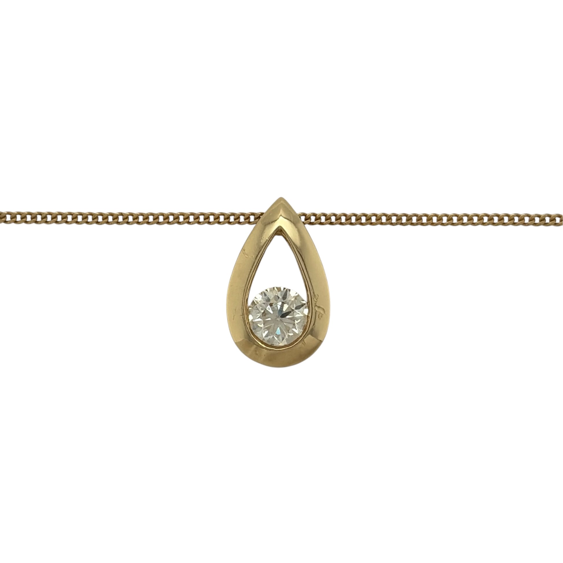 This pre-owned 18ct yellow gold diamond teardrop pendant necklace is an elegant design, featuring a brilliant cut diamond set within a classic teardrop-shaped pendant.

Design: Featuring a teardrop-shaped pendant, this necklace showcases a single brilliant cut diamond set in warm 18ct yellow gold and suspended from a curb chain.
Material: Made from 18-carat yellow gold.
Gemstone Detail: Set with one brilliant cut diamond of approximately 0.50ct.