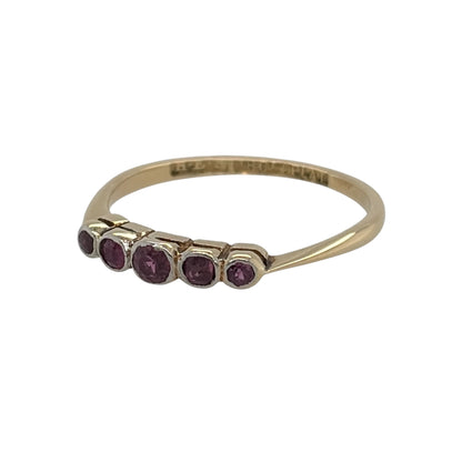 This pre-owned 18ct yellow gold and platinum vintage ruby five stone band ring is a traditional design, featuring five rubies set across the front.

Design: Featuring a vintage-style five stone arrangement, this ring has five rubies set across the front with a combination of warm 18ct yellow gold and platinum.
Material: Made from 18-carat yellow gold and platinum.
Gemstone Detail: Set with five rubies, with the centre ruby measuring approximately 3mm in diameter.