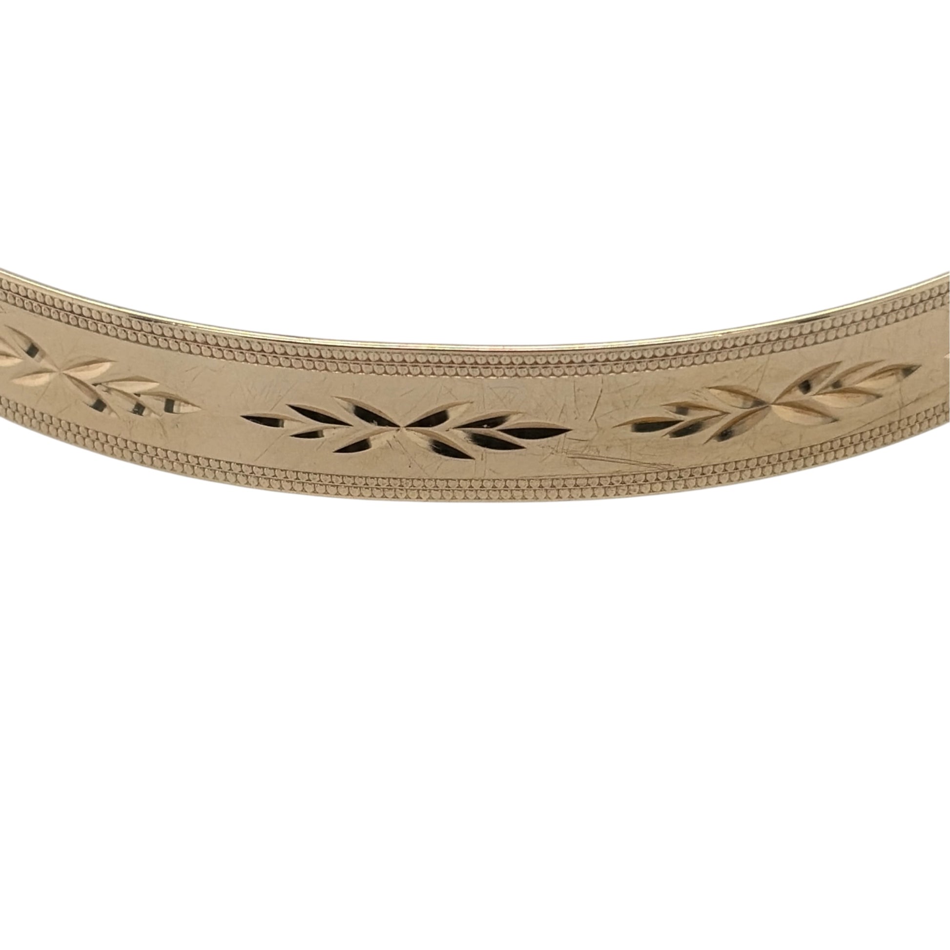 This pre-owned 9ct yellow gold patterned expander bangle is a classic design, featuring decorative detailing and an expandable profile for added flexibility.

Design: Featuring a patterned finish throughout, this bangle has a traditional expanding design finished in warm 9ct yellow gold.
Material: Made from 9-carat yellow gold.
Bangle Detail: Bangle measures approximately 7mm wide and features an expandable design.