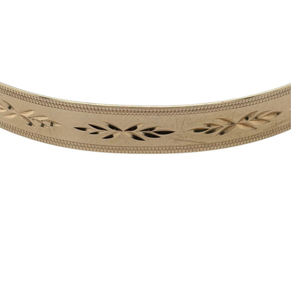 This pre-owned 9ct yellow gold patterned expander bangle is a classic design, featuring decorative detailing and an expandable profile for added flexibility.

Design: Featuring a patterned finish throughout, this bangle has a traditional expanding design finished in warm 9ct yellow gold.
Material: Made from 9-carat yellow gold.
Bangle Detail: Bangle measures approximately 7mm wide and features an expandable design.