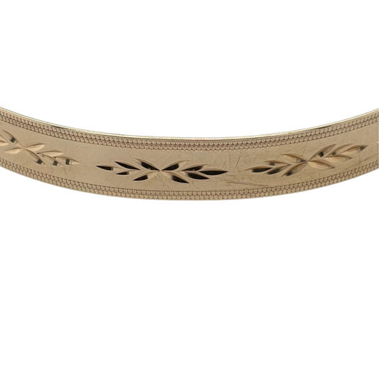 This pre-owned 9ct yellow gold patterned expander bangle is a classic design, featuring decorative detailing and an expandable profile for added flexibility.

Design: Featuring a patterned finish throughout, this bangle has a traditional expanding design finished in warm 9ct yellow gold.
Material: Made from 9-carat yellow gold.
Bangle Detail: Bangle measures approximately 7mm wide and features an expandable design.