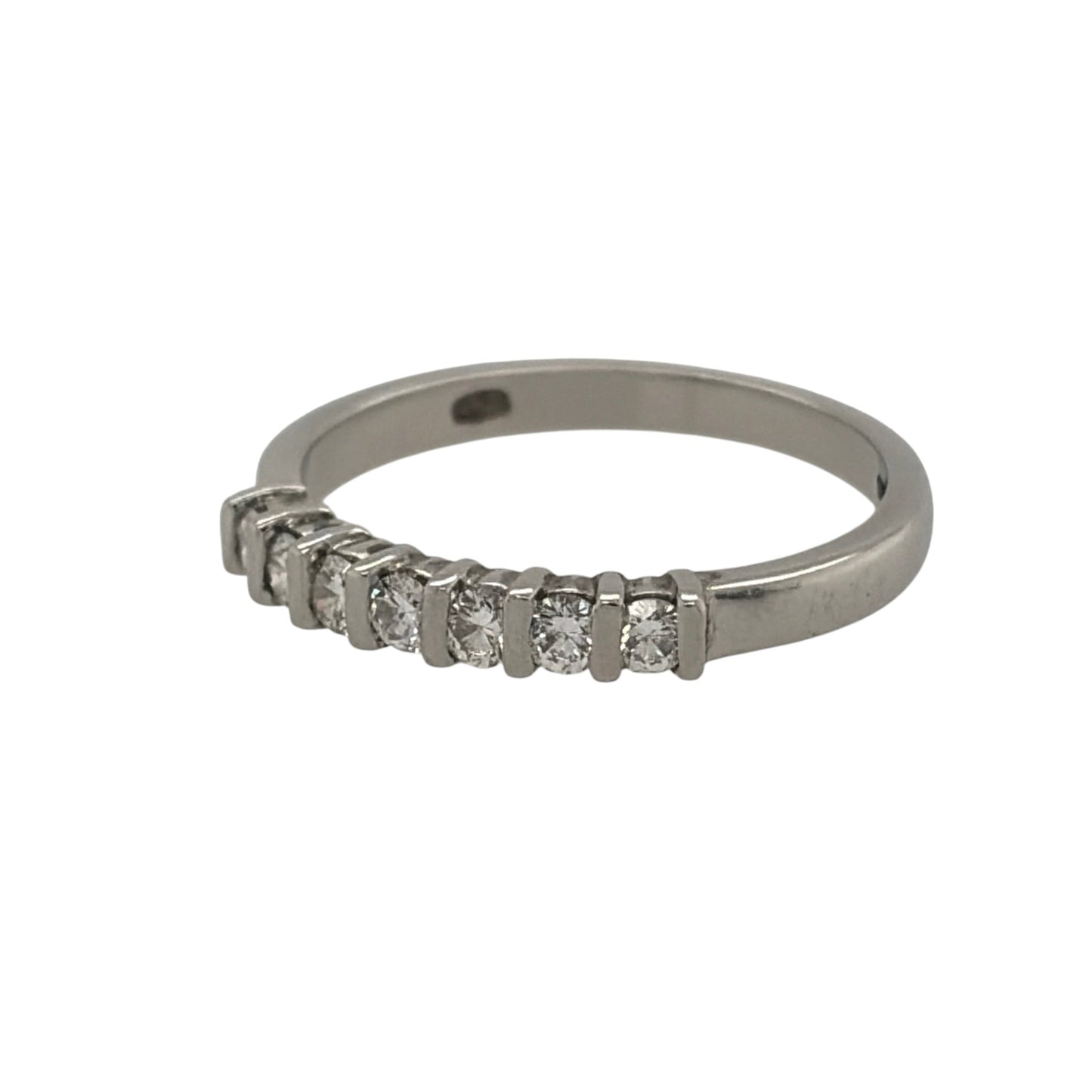 This pre-owned platinum diamond seven stone band ring is a timeless design, featuring seven diamonds set across the front of the band.

Design: Featuring a classic seven stone design, this ring has seven diamonds set across the front in platinum.
Material: Made from platinum.
Gemstone Detail: Set with seven diamonds across the front of the ring.
Ring Detail: The front of the band measures approximately 2mm wide.
Size & Weight: Ring size J. Total weight 2.80 grams.
