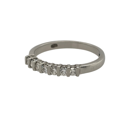 This pre-owned platinum diamond seven stone band ring is a timeless design, featuring seven diamonds set across the front of the band.

Design: Featuring a classic seven stone design, this ring has seven diamonds set across the front in platinum.
Material: Made from platinum.
Gemstone Detail: Set with seven diamonds across the front of the ring.
Ring Detail: The front of the band measures approximately 2mm wide.
Size & Weight: Ring size J. Total weight 2.80 grams.