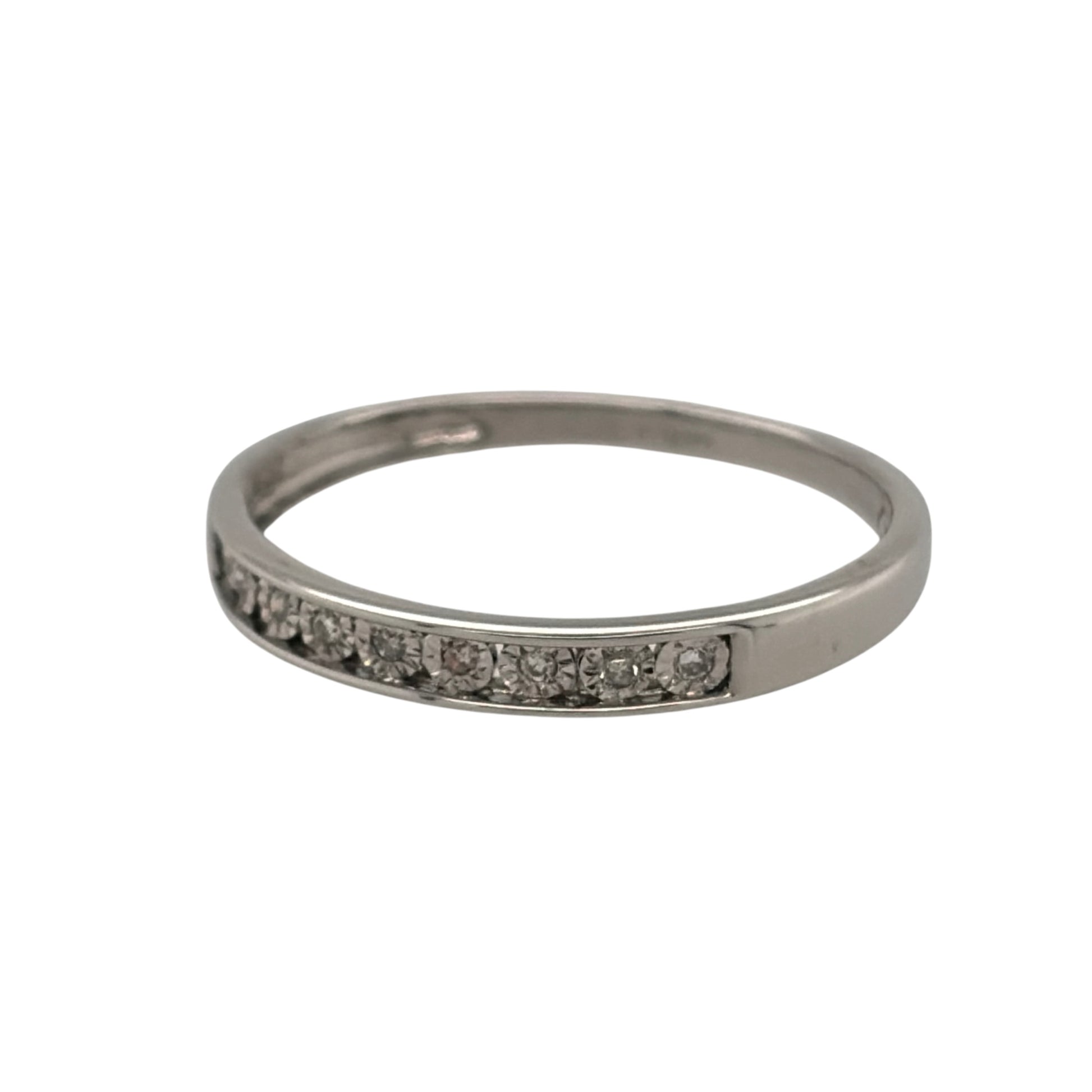 This pre-owned 9ct white gold diamond band ring is a classic design, featuring nine illusion-set diamonds across the front of the band.

Design: Featuring a simple diamond band design, this ring has nine diamonds arranged across the front in illusion-style settings for a distinctive finish.
Material: Made from 9-carat white gold.
Gemstone Detail: Set with nine illusion-set diamonds across the front of the ring.
Ring Detail: The front of the band measures approximately 2.5mm wide.