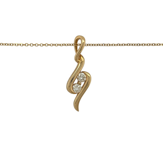 This pre-owned 18ct yellow gold double diamond wrap-around wave-style pendant necklace is a distinctive design, featuring two diamonds within a flowing curved pendant.

Design: Featuring a wrap-around wave-style design, this pendant has a flowing curved profile finished in warm 18ct yellow gold and suspended from a trace chain.
Material: Made from 18-carat yellow gold.
Gemstone Detail: Set with two diamonds within the wave-style design.
Pendant Detail: Pendant measures approximately 24mm by 8mm.