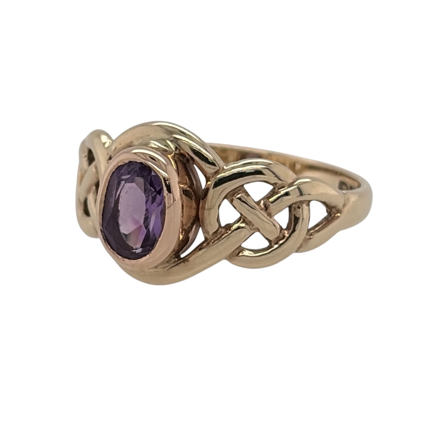 Celebrate Celtic heritage and timeless elegance with this pre-owned 9ct yellow and rose gold amethyst set Clogau Celtic Knot birthstone ring. Featuring a beautiful February birthstone and the iconic Celtic Knot design, this distinctive ring is perfect for everyday wear, a meaningful birthday gift, or a treasured addition to any Clogau jewellery collection.

Design: The ring showcases a 6mm by 4mm oval-cut amethyst, displaying rich violet hues that bring colour and sophistication to the elegant Celtic Knot