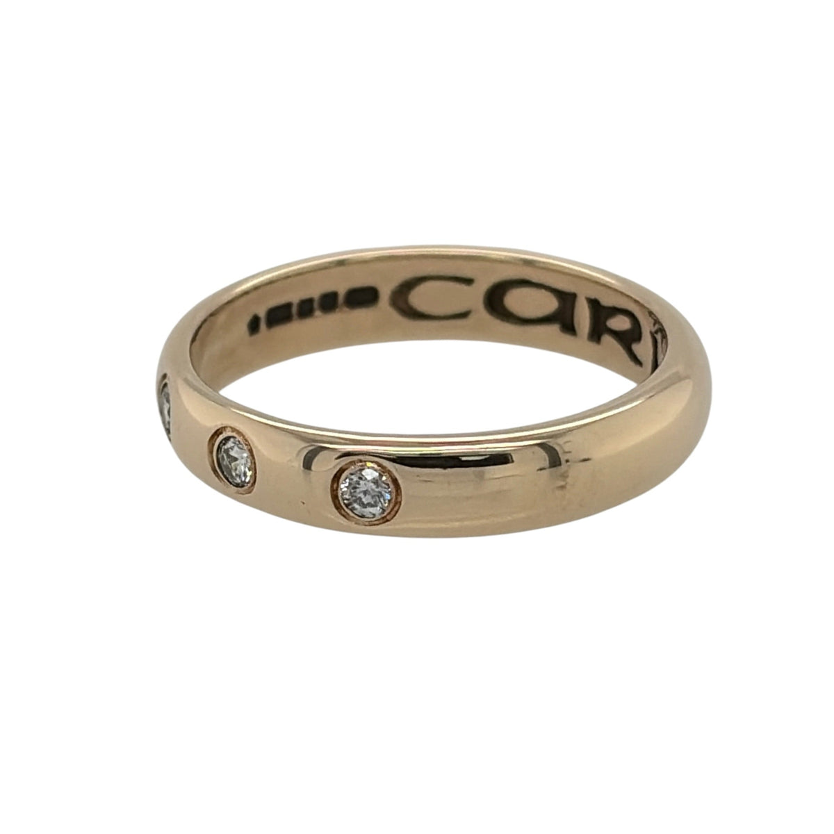 This pre-owned 9ct yellow gold Clogau diamond wedding band ring is a meaningful design, featuring three diamonds set within the band and a Cariad engraving inside.

Design: Featuring a classic wedding band profile, this Clogau ring has three diamonds set into the warm 9ct yellow gold for a subtle decorative finish.
Material: Made from 9-carat yellow gold.
Gemstone Detail: Set with three diamonds within the band.
Ring Detail: Band measures approximately 4mm wide and is engraved with “Cariad” inside.
