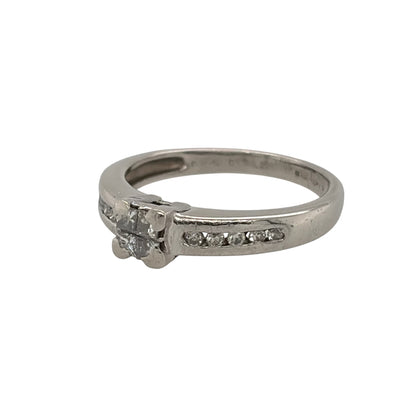 This pre-owned platinum diamond illusion solitaire ring is a striking design, featuring four princess cut diamonds set together to create the appearance of a larger centre stone.

Design: Featuring an illusion solitaire design, this ring has four princess cut diamonds closely set together at the centre, complemented by diamond-set shoulders.
Material: Made from platinum.