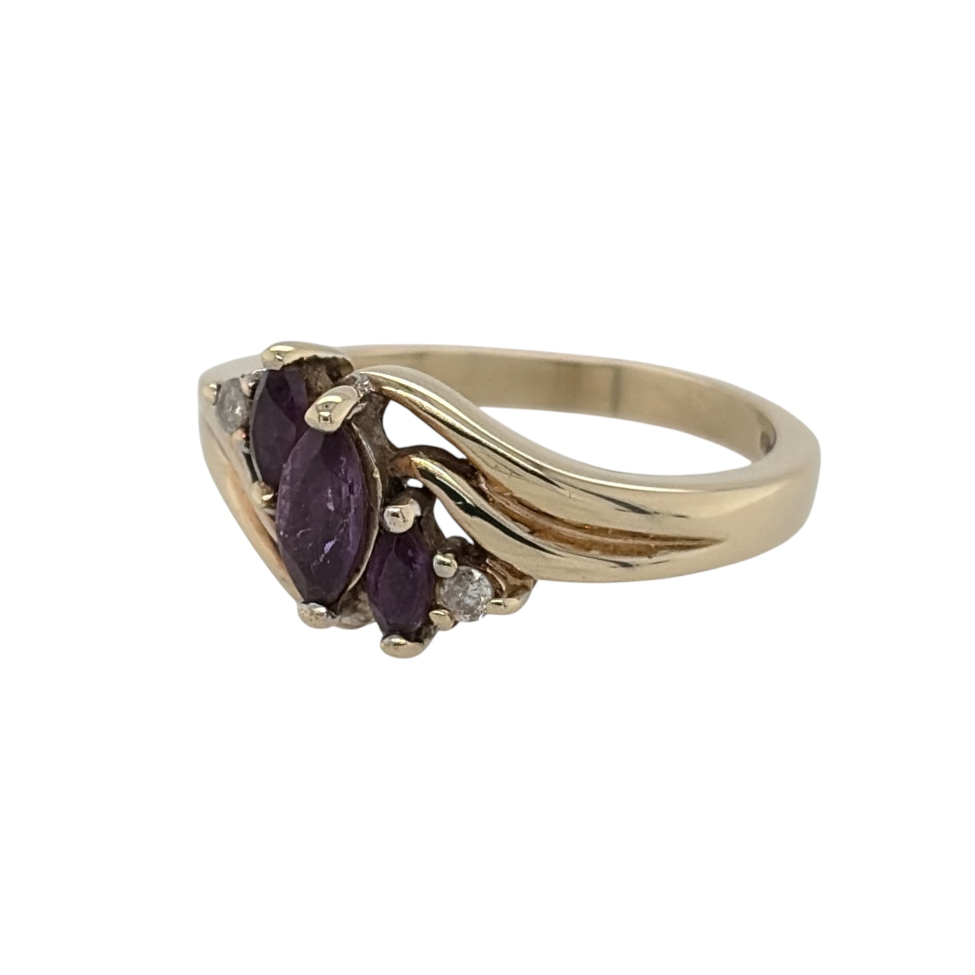 This pre-owned 9ct yellow gold diamond and amethyst ring is a classic gemstone design, featuring a marquise cut amethyst centre stone complemented by diamond detailing.

Design: Featuring a marquise-shaped amethyst as the centrepiece, this ring combines rich purple tones with diamond detailing in warm 9ct yellow gold.
Material: Made from 9-carat yellow gold.
Gemstone Detail: Set with a central marquise cut amethyst measuring approximately 6mm by 3mm, complemented by diamond detailing.