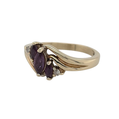 This pre-owned 9ct yellow gold diamond and amethyst ring is a classic gemstone design, featuring a marquise cut amethyst centre stone complemented by diamond detailing.

Design: Featuring a marquise-shaped amethyst as the centrepiece, this ring combines rich purple tones with diamond detailing in warm 9ct yellow gold.
Material: Made from 9-carat yellow gold.
Gemstone Detail: Set with a central marquise cut amethyst measuring approximately 6mm by 3mm, complemented by diamond detailing.