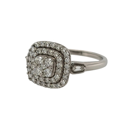 This pre-owned 9ct white gold diamond double halo cluster ring is a striking design, featuring a cushion-shaped profile with multiple rows of diamond detailing.

Design: Featuring a cushion-shaped cluster with a double halo design, this ring has multiple diamonds arranged across the front for a bold and detailed appearance.
Material: Made from 9-carat white gold.
Gemstone Detail: Set with approximately 0.61ct of diamond content in total throughout the cluster design.
