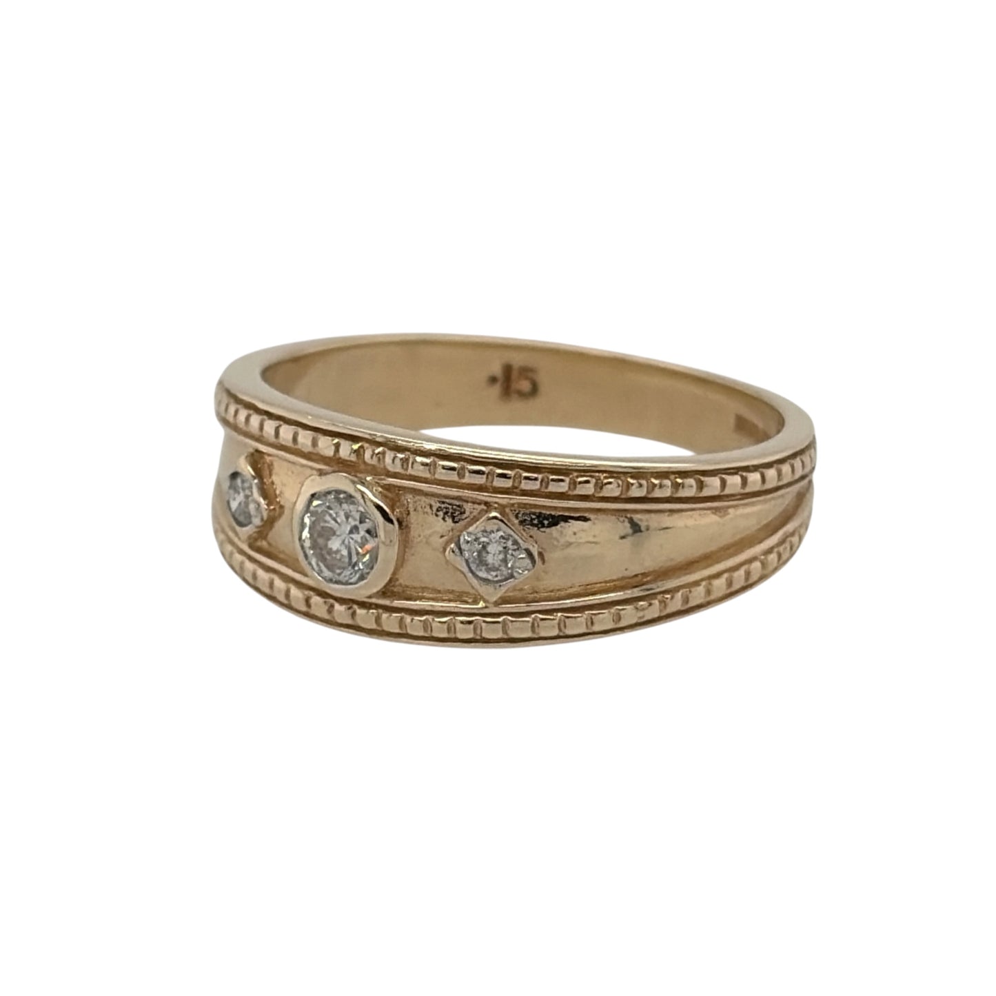 This pre-owned 9ct yellow gold diamond trilogy band ring is a distinctive design, featuring three diamonds with decorative milgrain-style edging.

Design: Featuring a traditional trilogy design, this ring has three diamonds set across the front with milgrain-style edging for a detailed vintage-inspired appearance.
Material: Made from 9-carat yellow gold.
Gemstone Detail: Set with three diamonds across the front of the ring.