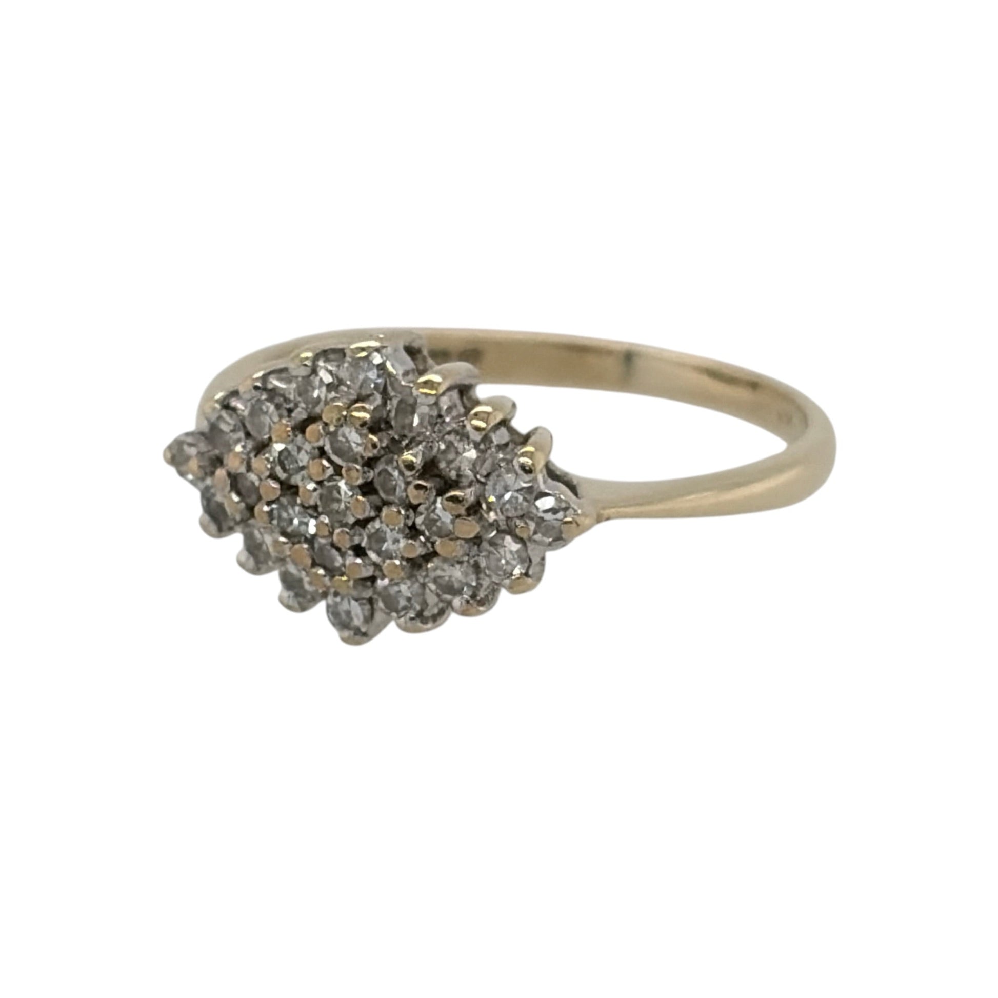 This pre-owned 9ct yellow gold diamond cluster ring is a classic design, featuring multiple diamonds arranged together across the front of the ring.

Design: Featuring a traditional cluster design, this ring has multiple diamonds grouped together to create a decorative centrepiece in warm 9ct yellow gold.
Material: Made from 9-carat yellow gold.
Gemstone Detail: Set with multiple diamonds within the cluster design.
Ring Detail: The front of the ring measures approximately 8mm high.