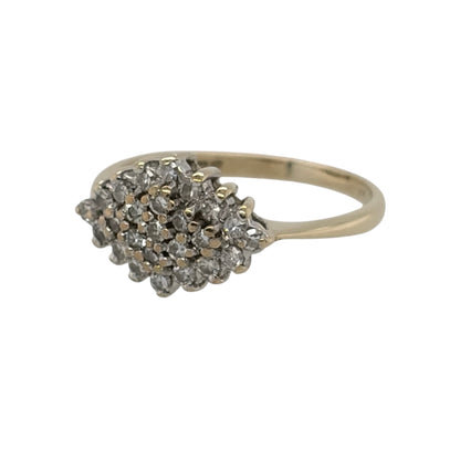 This pre-owned 9ct yellow gold diamond cluster ring is a classic design, featuring multiple diamonds arranged together across the front of the ring.

Design: Featuring a traditional cluster design, this ring has multiple diamonds grouped together to create a decorative centrepiece in warm 9ct yellow gold.
Material: Made from 9-carat yellow gold.
Gemstone Detail: Set with multiple diamonds within the cluster design.
Ring Detail: The front of the ring measures approximately 8mm high.