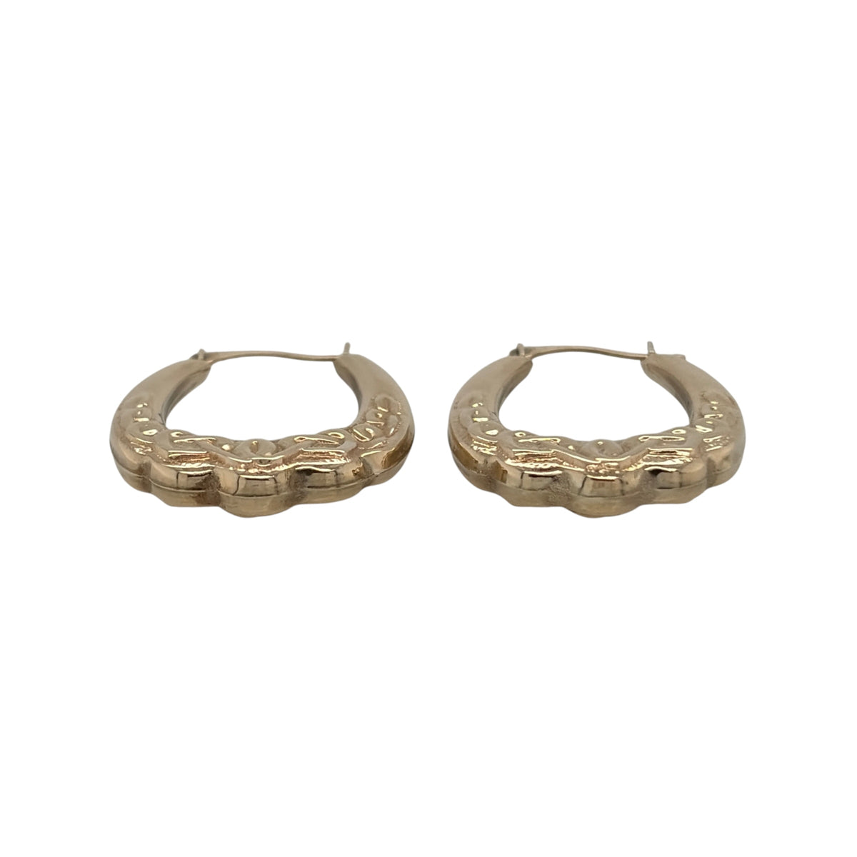 This pre-owned 9ct yellow gold Celtic knot oval Creole earrings are a distinctive design, featuring traditional Celtic-inspired detailing.

Design: Featuring an oval Creole shape with decorative Celtic knot detailing, these earrings have a traditional patterned finish in warm 9ct yellow gold.
Material: Made from 9-carat yellow gold.
Earring Detail: Oval Creole design featuring traditional Celtic knot patterned detailing.
Size & Weight: Total combined weight 1.30 grams.
