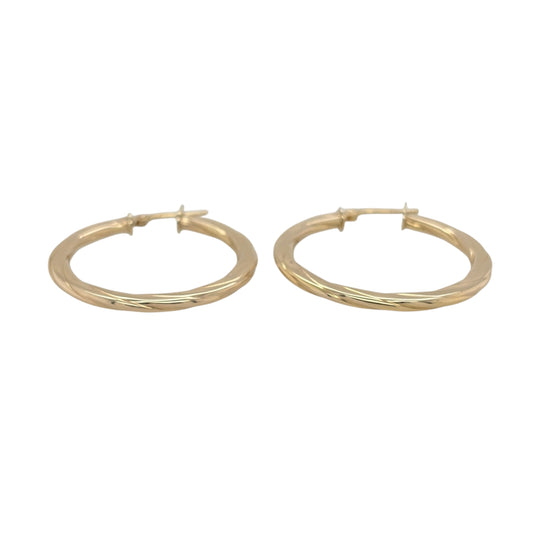 This pre-owned 9ct yellow gold twisted flat hoop Creole earrings are a classic design, featuring a flattened profile with decorative twisted detailing.

Design: Featuring a flat hoop Creole shape with a twisted design, these earrings have a distinctive textured appearance finished in warm 9ct yellow gold.
Material: Made from 9-carat yellow gold.
Earring Detail: Flat hoop Creole design featuring decorative twisted detailing.
Size & Weight: Total combined weight 2.50 grams.