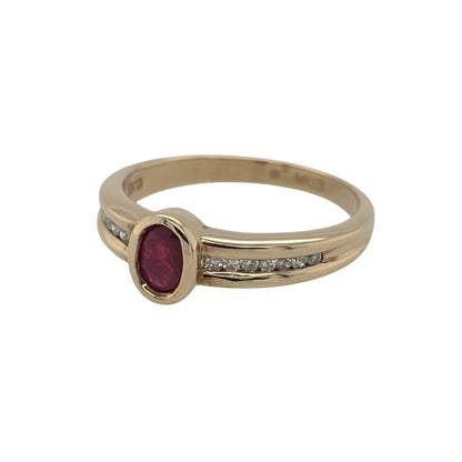 This pre-owned 9ct yellow gold diamond and ruby ring is a classic gemstone design, featuring an oval ruby centre stone complemented by diamond-set shoulders.

Design: Featuring an oval ruby as the centrepiece, this ring has diamond detailing set along the shoulders and is finished in warm 9ct yellow gold.
Material: Made from 9-carat yellow gold.
Gemstone Detail: Set with an oval ruby measuring approximately 5mm by 3mm, complemented by diamonds set along the shoulders.