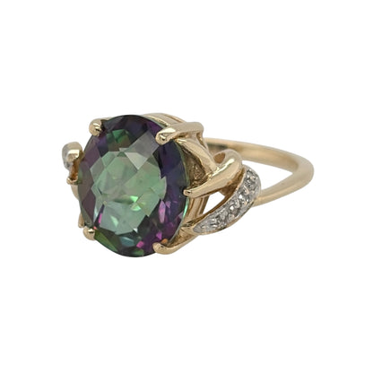 This pre-owned 9ct yellow gold diamond and mystic topaz ring is a striking dress ring, featuring a large oval mystic topaz complemented by diamond detailing.

Design: Featuring a large oval mystic topaz as the centrepiece, this ring combines colourful gemstone tones with diamond detailing in warm 9ct yellow gold.
Material: Made from 9-carat yellow gold.
Gemstone Detail: Set with an oval mystic topaz measuring approximately 12mm by 10mm, complemented by diamond detailing.