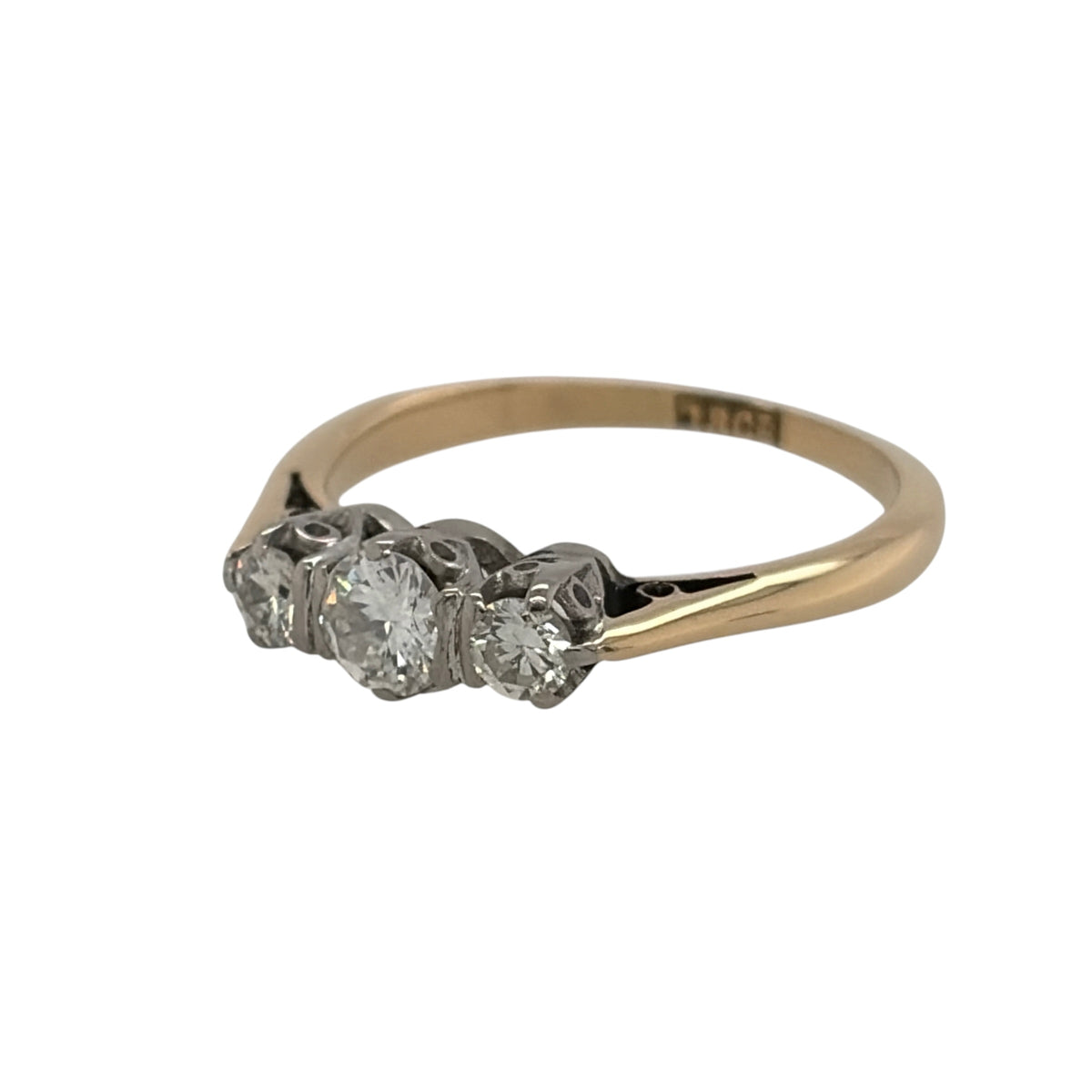 This pre-owned 18ct yellow gold diamond trilogy ring is a timeless design, featuring three diamonds set together across the front of the ring.

Design: Featuring a classic trilogy design, this ring has three diamonds arranged across the front and finished in warm 18ct yellow gold.
Material: Made from 18-carat yellow gold.
Gemstone Detail: Set with three diamonds with approximately 0.25ct of diamond content in total.
Ring Detail: Classic three stone trilogy setting designed to showcase the diamonds.