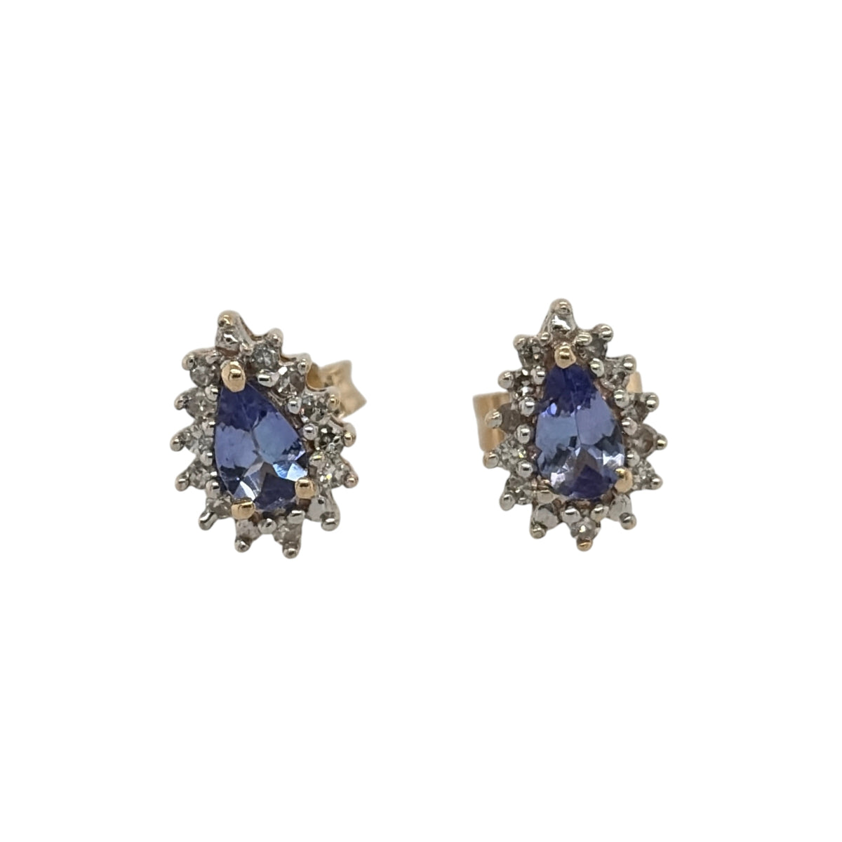 This pre-owned 9ct yellow gold diamond and tanzanite teardrop cluster stud earrings are a classic gemstone design, featuring teardrop-shaped tanzanites complemented by diamond detailing.

Design: Featuring a teardrop cluster design, these stud earrings showcase tanzanite centre stones surrounded by diamond detailing in warm 9ct yellow gold.
Material: Made from 9-carat yellow gold.