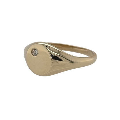 New 9ct Yellow Gold &amp; Cubic Zirconia Round Signet Ring in various sizes with the approximate weight 1.30 grams. The front of the ring is 7mm high