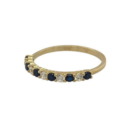 New 9ct Gold Sapphire coloured blue stone &amp; Cubic Zirconia Band Ring in various sizes with the approximate weight 1.20 grams. The front of the band is approx 2mm wide