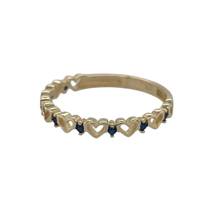 New 9ct Yellow Gold &amp; Sapphire coloured blue stones Heart Band Ring in various sizes with the approximate weight 0.90 grams. The front of the band is approx 3mm wide