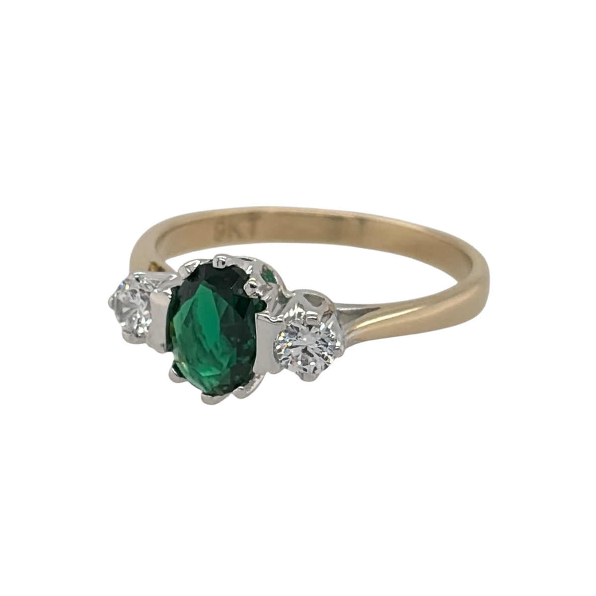 New 9ct Yellow Gold Emerald coloured green stone &amp; Cubic Zirconia Trilogy Ring in various sizes with the approximate weight 2.20 grams. The center oval green stone is 6mm by 4mm