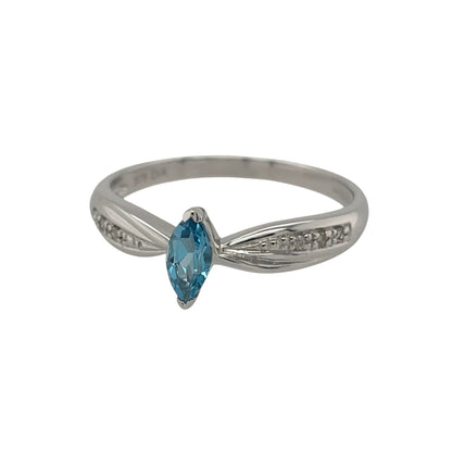 New 9ct White Gold Diamond &amp; Blue Topaz Ring in various sizes with the approx weight 1.80 grams. There is approximatley 0.10ct of diamond content in the ring has approximate clarity i2-i3 and colour H - I. The marquise cut blue topaz stone is 6mm by 3mm