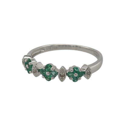 New 9ct White Gold Diamond &amp; Emerald Flower Band Ring in various sizes with the approx weight 1.70 grams. There is approximatley 0.08ct of diamond content in the ring has approximate clarity i2-i3 and colour H - I