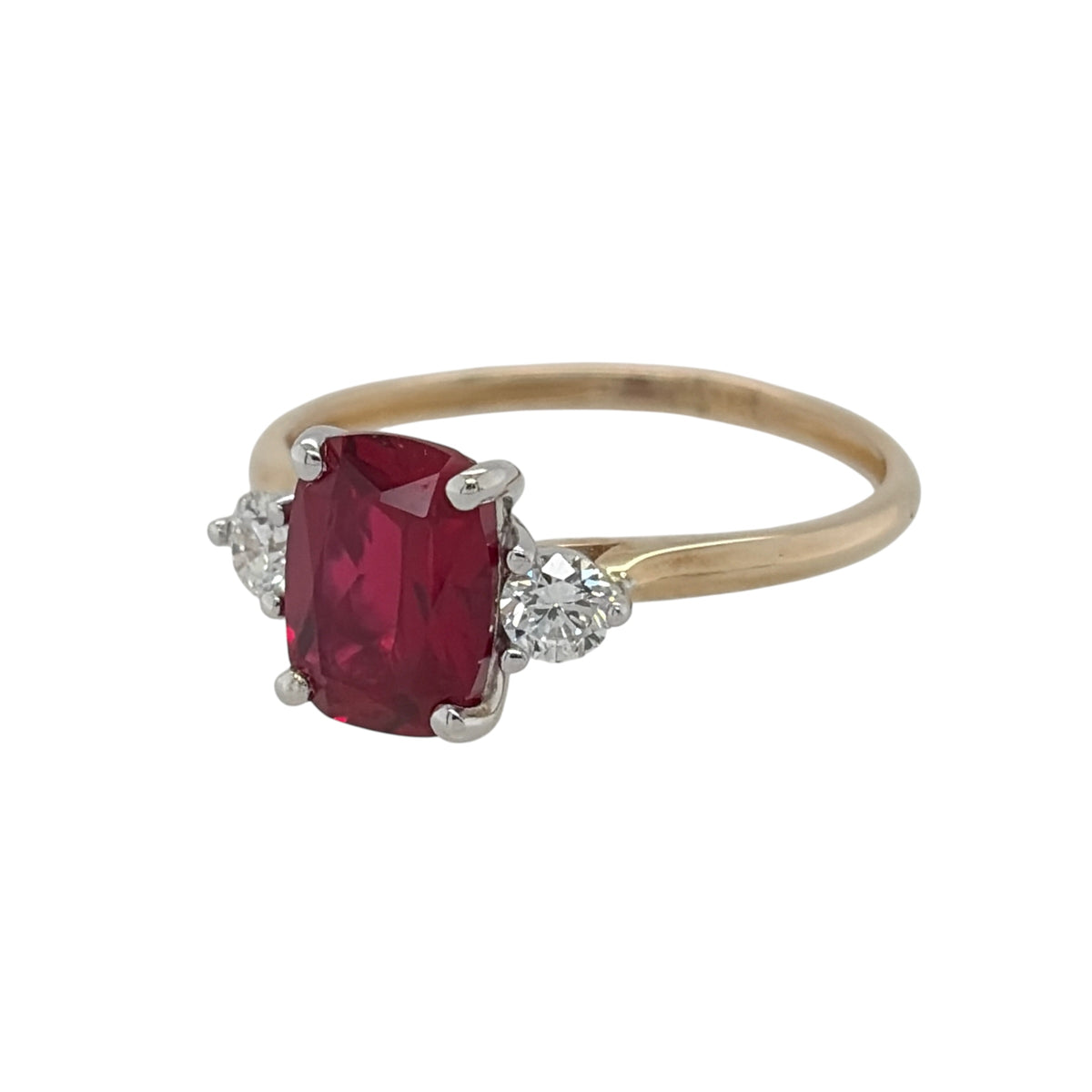 New 9ct Gold Lab Grown Diamond &amp; Lab Grown Ruby Trilogy Ring in various sizes with the approx weight 1.80 grams. There is approximatley 0.16ct of lab grown diamond content in the ring has approximate clarity i2 and colour J. The elongated cushion lab grown ruby stone is 8mm by 6mm