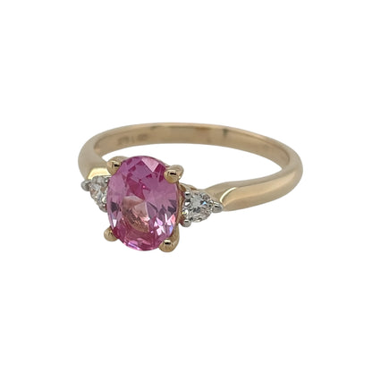 New 9ct Gold Lab Grown Diamond &amp; Lab Grown Pink Sapphire Trilogy Ring in various sizes with the approx weight 2.45 grams. There is approximatley 0.16ct of lab grown diamond content in the ring has approximate clarity i2 and colour J. The oval lab grown pink sapphire is 8mm by 6mm