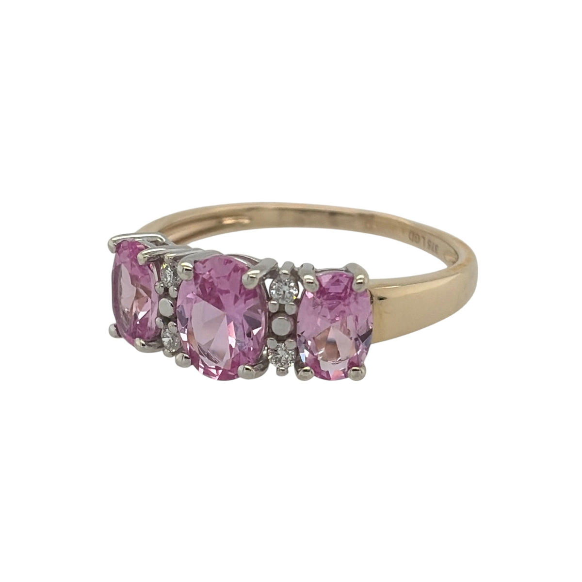 New 9ct Gold Lab Grown Diamond &amp; Lab Grown Pink Sapphire Trilogy Cluster Ring in various sizes with the approx weight 2.25 grams. There is approximatley 0.20ct of lab grown diamond content in the ring has approximate clarity i2 and colour J. The center lab grown pink sapphire oval stone is 7mm by 5mm and the side ones are 6mm by 4mm
