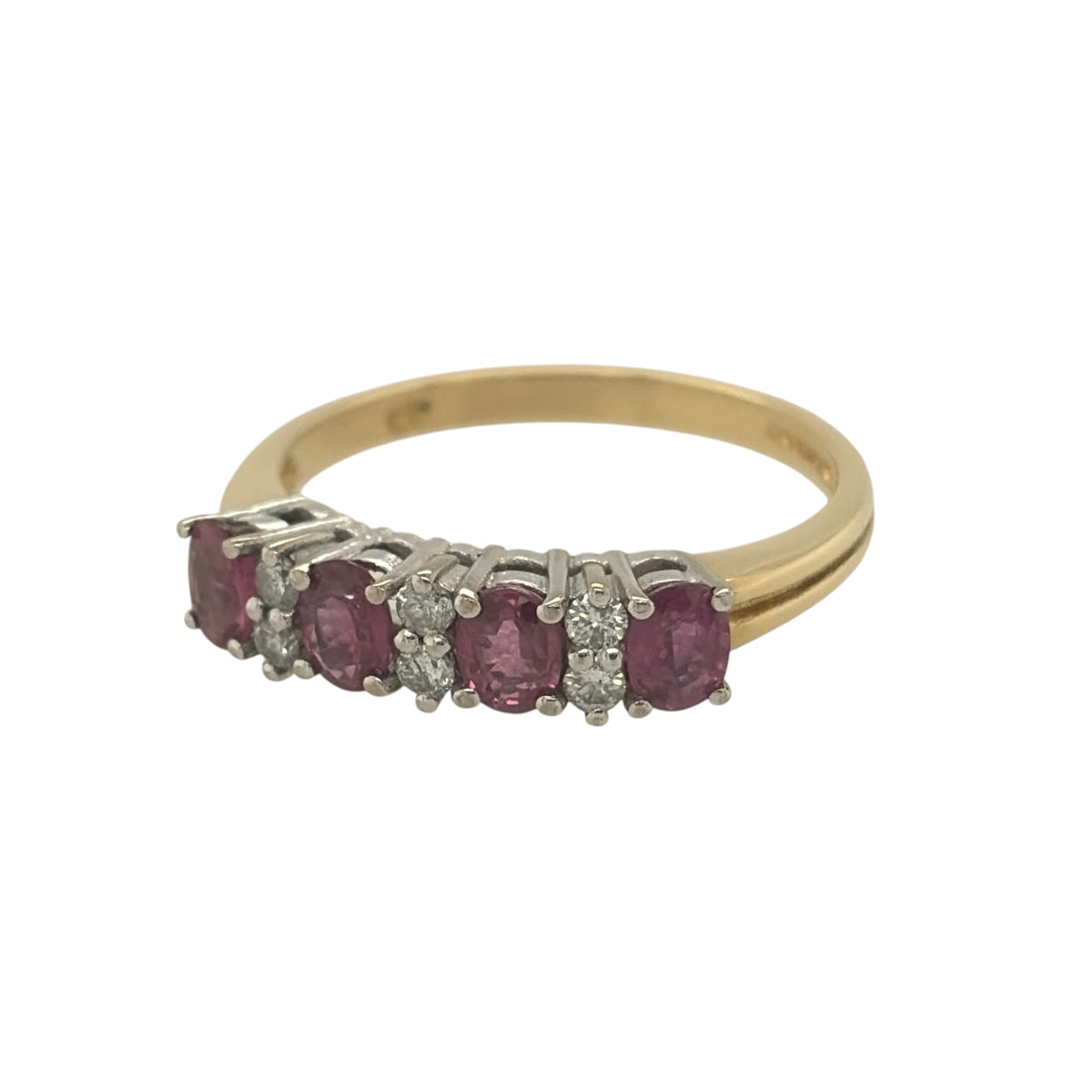 This pre-owned 18ct yellow gold diamond and ruby band ring is a classic gemstone design, featuring oval rubies with diamond detailing set between.

Design: Featuring a traditional gemstone band design, this ring has oval rubies arranged across the front with diamonds set between in warm 18ct yellow gold.
Material: Made from 18-carat yellow gold.
Gemstone Detail: Set with oval ruby stones measuring approximately 4mm by 3.5mm each, complemented by diamonds set between.