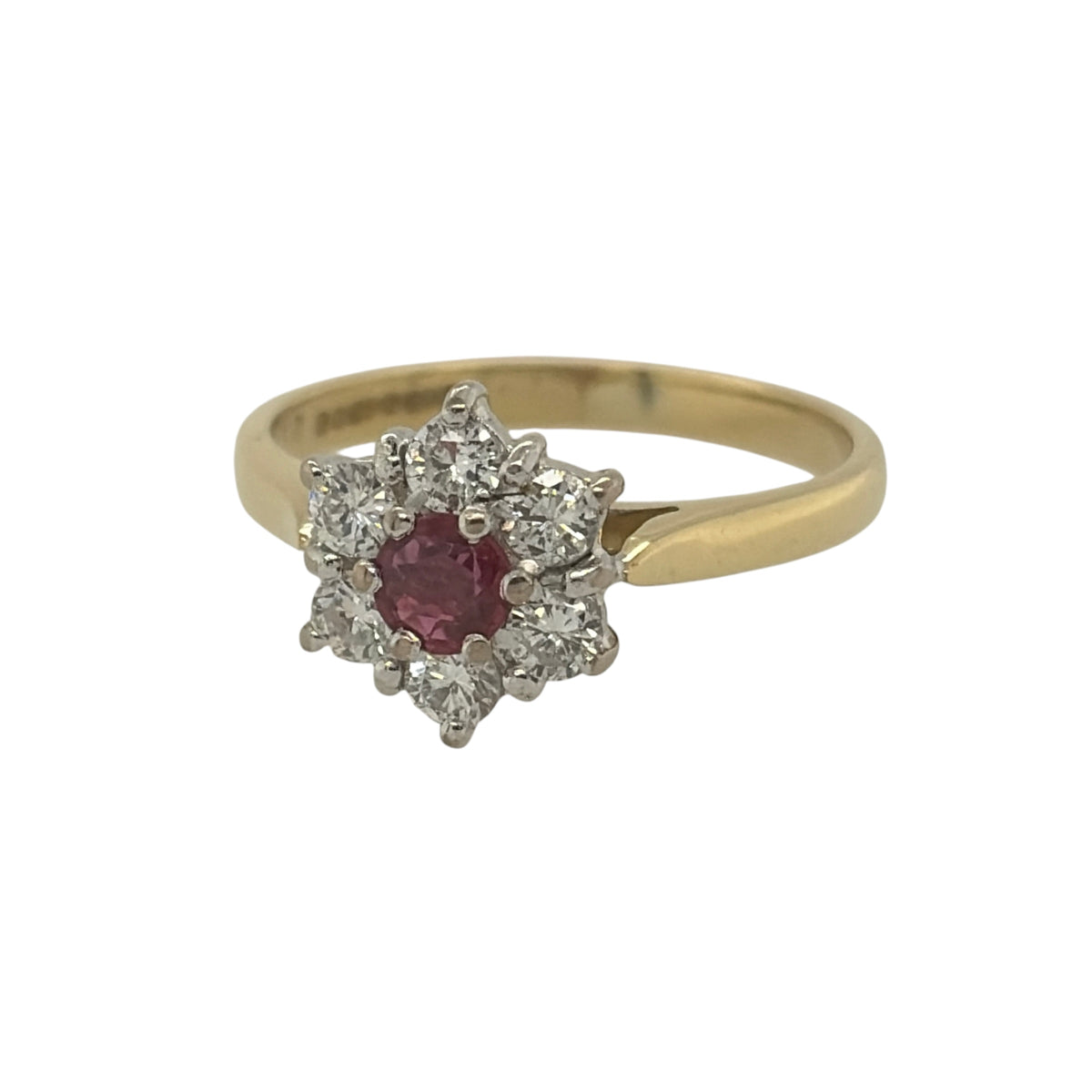 This pre-owned 18ct yellow gold diamond and ruby flower cluster ring is a classic gemstone design, featuring a central ruby surrounded by diamond detailing in a floral arrangement.

Design: Featuring a flower-shaped cluster design, this ring showcases a round ruby at the centre surrounded by diamonds and finished in warm 18ct yellow gold.
Material: Made from 18-carat yellow gold.
Gemstone Detail: Set with a central ruby measuring approximately 4mm in diameter, complemented by surrounding diamond detailing.