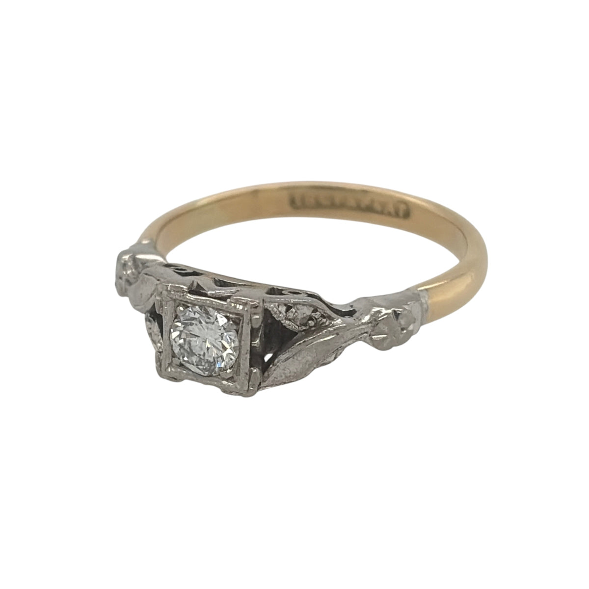 This pre-owned 18ct yellow gold and platinum diamond solitaire ring is a classic two-tone design, featuring a brilliant cut diamond within a square platinum setting.

Design: Featuring a traditional solitaire design, this ring combines a warm 18ct yellow gold band with a contrasting square platinum setting.
Material: Made from 18-carat yellow gold and platinum.
Gemstone Detail: Set with a brilliant cut diamond of approximately 0.25ct.
