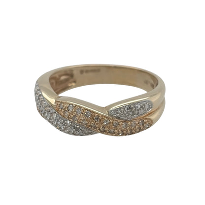 This pre-owned 14ct yellow and white gold diamond twist cluster band ring is a distinctive two-tone design, featuring diamond detailing within a decorative twisted setting.

Design: Featuring a twist-style cluster band design, this ring combines warm yellow gold with contrasting white gold diamond detailing across the front.
Material: Made from 14-carat yellow and white gold.
Gemstone Detail: Set with approximately 0.25ct of diamond content in total.