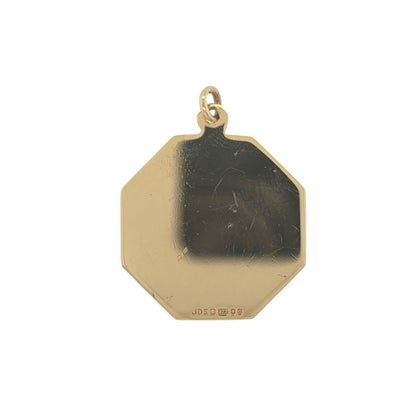 This pre-owned 9ct yellow gold octagon-shaped St Christopher pendant is a traditional design, featuring the iconic St Christopher motif within a distinctive eight-sided shape.

Design: Featuring an octagon-shaped profile, this pendant displays a traditional St Christopher design finished in warm 9ct yellow gold.
Material: Made from 9-carat yellow gold.
Pendant Detail: The bail measures approximately 2mm in diameter.
Size & Weight: Total weight 3.50 grams.