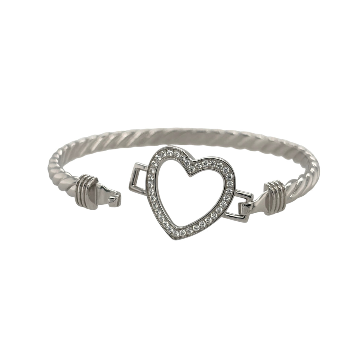 This new 925 sterling silver cubic zirconia set children’s open heart twisted bangle is a pretty design, featuring an open heart centrepiece with stone detailing.

Design: Featuring a twisted bangle design with an open heart centrepiece, this children’s bangle has a polished silver finish with cubic zirconia detailing.
Material: Made from 925 sterling silver.
Gemstone Detail: Set with cubic zirconia stones for added detail across the design.
Bangle Detail: The front of the bangle measures approximately 10mm