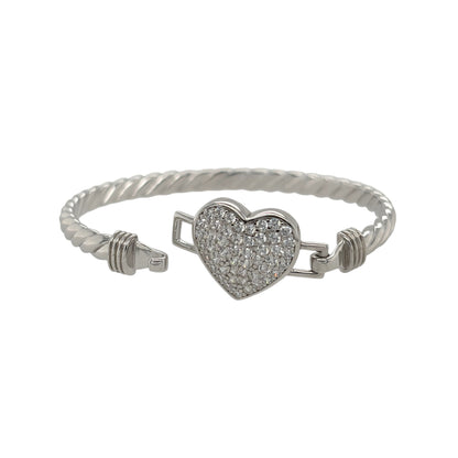 This new 925 sterling silver cubic zirconia set children’s heart twisted bangle is a pretty design, featuring a heart centrepiece with stone detailing.

Design: Featuring a twisted bangle design with a heart centrepiece, this children’s bangle has a polished silver finish with cubic zirconia detailing.
Material: Made from 925 sterling silver.
Gemstone Detail: Set with cubic zirconia stones for added detail across the heart design.
Bangle Detail: The front of the bangle measures approximately 15mm high.