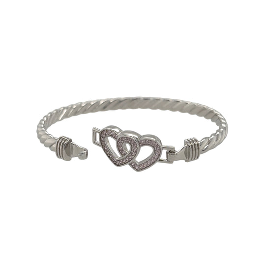 This new 925 sterling silver pink cubic zirconia set children’s double heart twisted bangle is a pretty design, featuring two heart details with colourful stone accents.

Design: Featuring a twisted bangle design with a double heart centrepiece, this children’s bangle has a polished silver finish with pink cubic zirconia detailing.
Material: Made from 925 sterling silver.
Gemstone Detail: Set with pink cubic zirconia stones across the heart design.