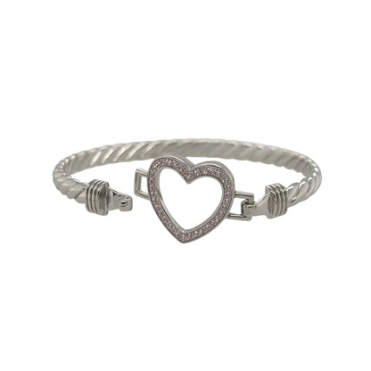This new 925 sterling silver pink cubic zirconia set children’s open heart twisted bangle is a pretty design, featuring an open heart centrepiece with colourful stone detailing.

Design: Featuring a twisted bangle design with an open heart centrepiece, this children’s bangle has a polished silver finish with pink cubic zirconia detailing.
Material: Made from 925 sterling silver.
Gemstone Detail: Set with pink cubic zirconia stones across the open heart design.