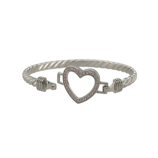 This new 925 sterling silver pink cubic zirconia set children’s open heart twisted bangle is a pretty design, featuring an open heart centrepiece with colourful stone detailing.

Design: Featuring a twisted bangle design with an open heart centrepiece, this children’s bangle has a polished silver finish with pink cubic zirconia detailing.
Material: Made from 925 sterling silver.
Gemstone Detail: Set with pink cubic zirconia stones across the open heart design.