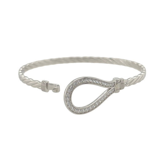 This new 925 sterling silver cubic zirconia set horseshoe bangle is a distinctive design, featuring a horseshoe centrepiece with stone detailing.

Design: Featuring a horseshoe design across the front, this bangle has a polished silver finish with cubic zirconia detailing.
Material: Made from 925 sterling silver.
Gemstone Detail: Set with cubic zirconia stones across the horseshoe design.
Bangle Detail: The front of the bangle measures approximately 17mm high.