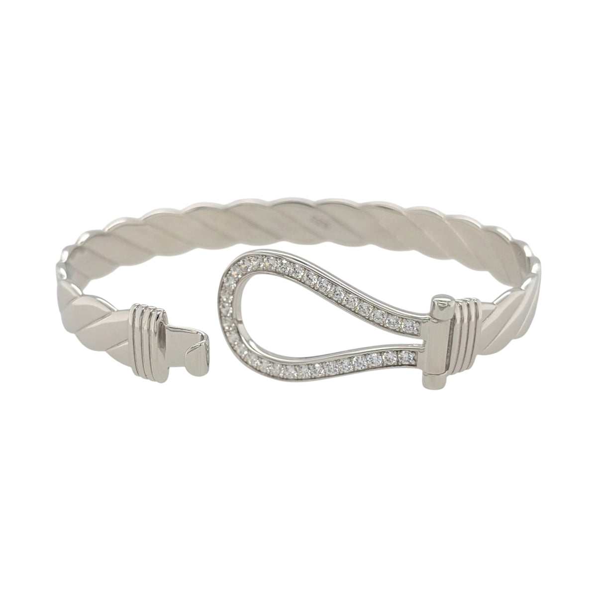 This new 925 sterling silver cubic zirconia set horseshoe twisted bangle is a substantial design, featuring a horseshoe centrepiece with stone detailing.

Design: Featuring a twisted bangle design with a horseshoe centrepiece, this bangle has a polished silver finish with cubic zirconia detailing.
Material: Made from 925 sterling silver.
Gemstone Detail: Set with cubic zirconia stones across the horseshoe design.
Bangle Detail: The front of the bangle measures approximately 20mm high.