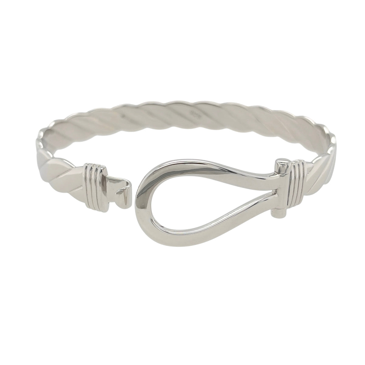 This new 925 sterling silver horseshoe twisted bangle is a substantial design, featuring a traditional horseshoe centrepiece with a decorative twisted profile.

Design: Featuring a twisted bangle design with a horseshoe centrepiece, this bangle has a polished silver finish with a bold and traditional appearance.
Material: Made from 925 sterling silver.
Bangle Detail: The horseshoe front measures approximately 20mm high, complemented by the twisted design of the bangle.