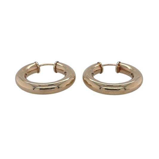 This pre-owned 9ct yellow gold plain hoop creole earrings are a classic design, featuring a simple rounded profile with a polished finish.

Design: Featuring a traditional plain hoop creole design, these earrings have a smooth profile finished in warm 9ct yellow gold.
Material: Made from 9-carat yellow gold.
Earring Detail: Each hoop measures approximately 26mm in diameter.
Size & Weight: Total weight 3.30 grams.