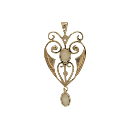 This pre-owned 9ct yellow gold opalique and pearl fancy vintage-style pendant is an ornate design, featuring two opalique stones with delicate seed pearl detailing.

Design: Featuring a decorative vintage-style design, this pendant combines two opalique stones with four seed pearls in an ornate 9ct yellow gold setting.
Material: Made from 9-carat yellow gold.