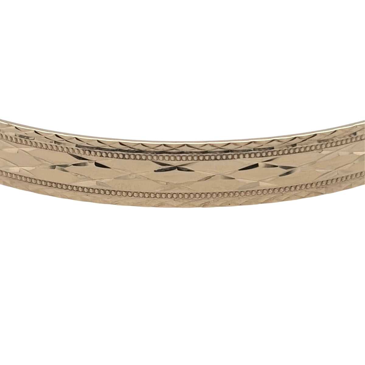 This pre-owned 9ct yellow gold patterned expanding bangle is a substantial design, featuring decorative detailing with an adjustable expanding profile.

Design: Featuring decorative patterned detailing, this bangle has a traditional expanding design finished in warm 9ct yellow gold.
Material: Made from 9-carat yellow gold.
Bangle Detail: The bangle measures approximately 7mm wide and features an expanding design for an adjustable fit.
